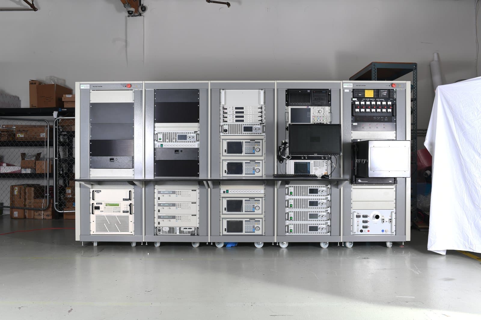 Five-bay Intepro rack row photographed from an angle, showing bay depth and cable management